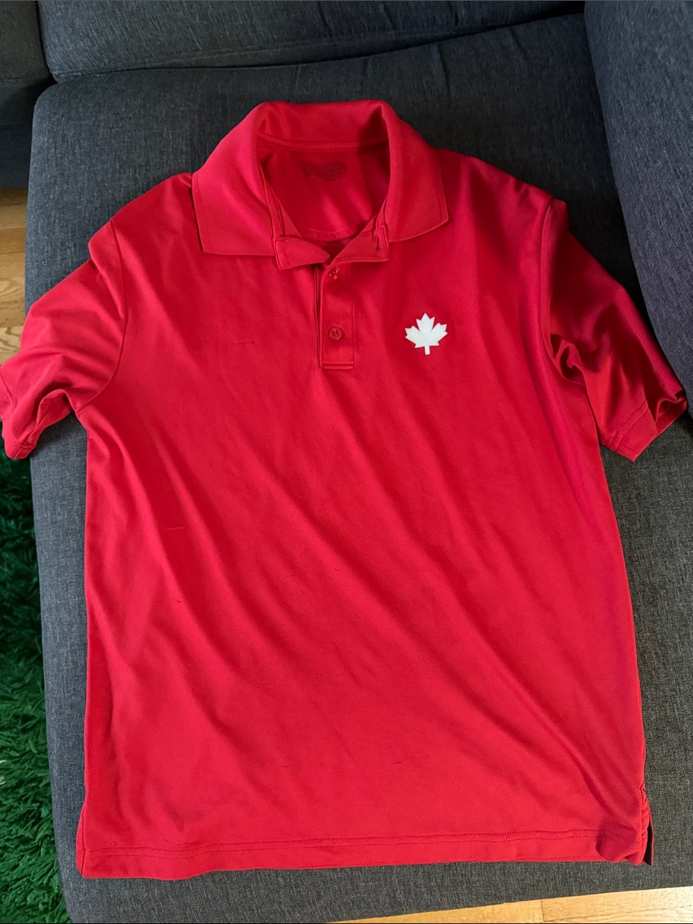 Men's Red Polo Shirt with White Maple Leaf Emblem